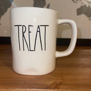 Rae Dunn m stamped trick or treat mug orange inside